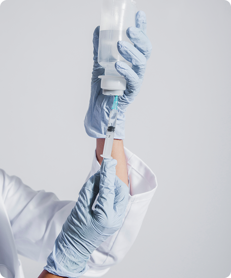 Medical professional with IV therapy equipment